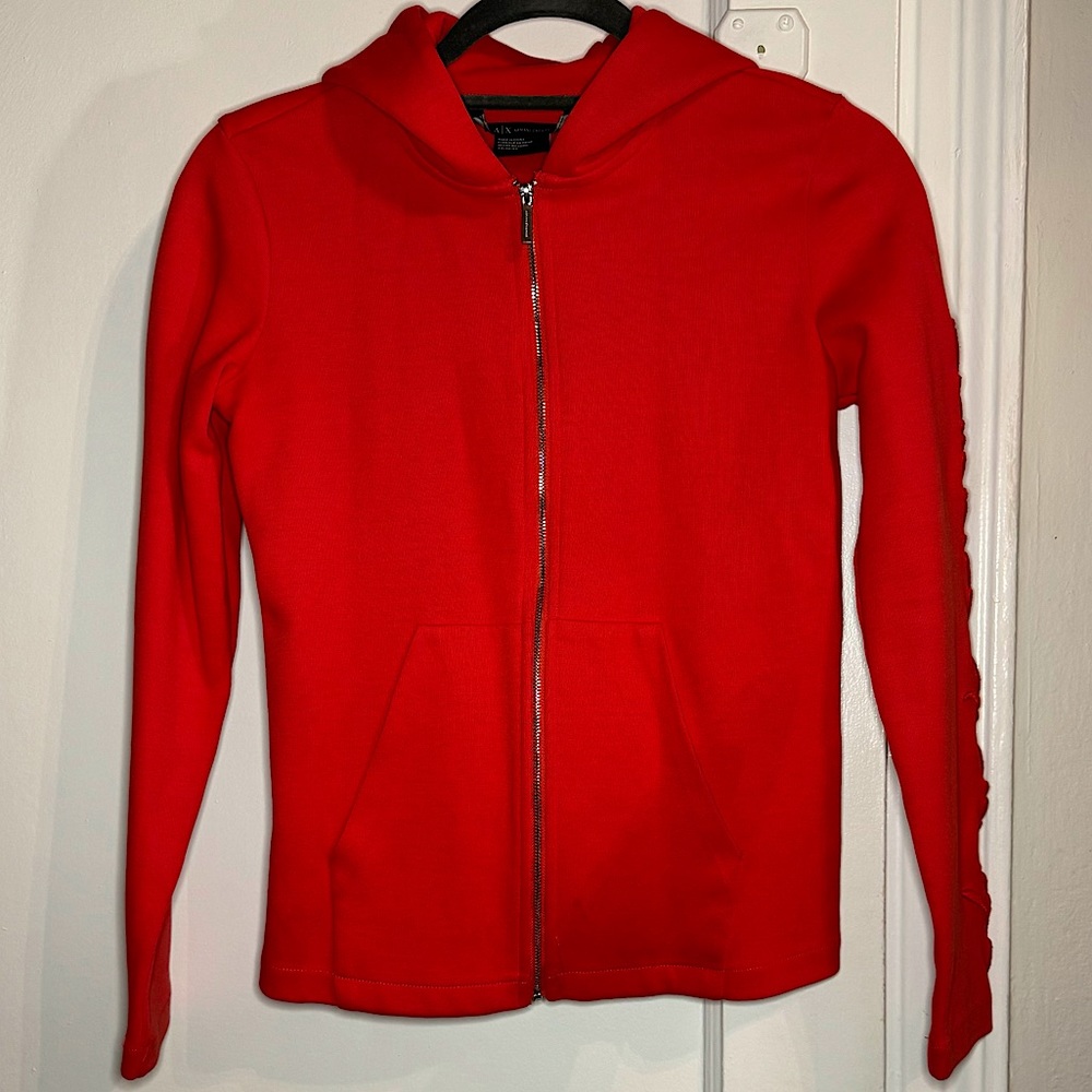 Armani Exchange zip up with details on the left sleeve. Sleek fit